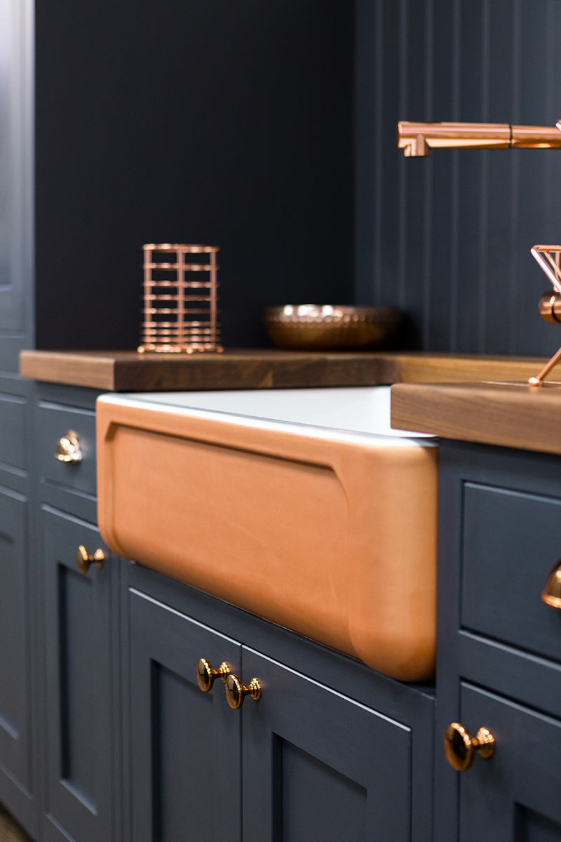 A TRADITIONAL SHAKER KITCHEN WITH A MODERN COPPER BELFAST SINK