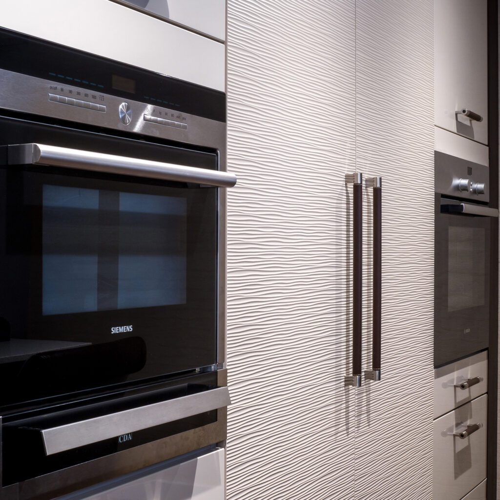 Siemens ovens in modern textured kitchen unit